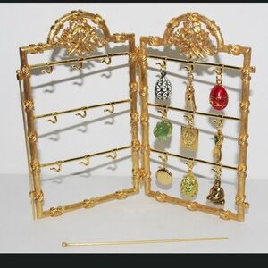 Joan River two panel display holder stand